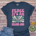 PEACE An Inside Job T-Shirt in Heather Navy